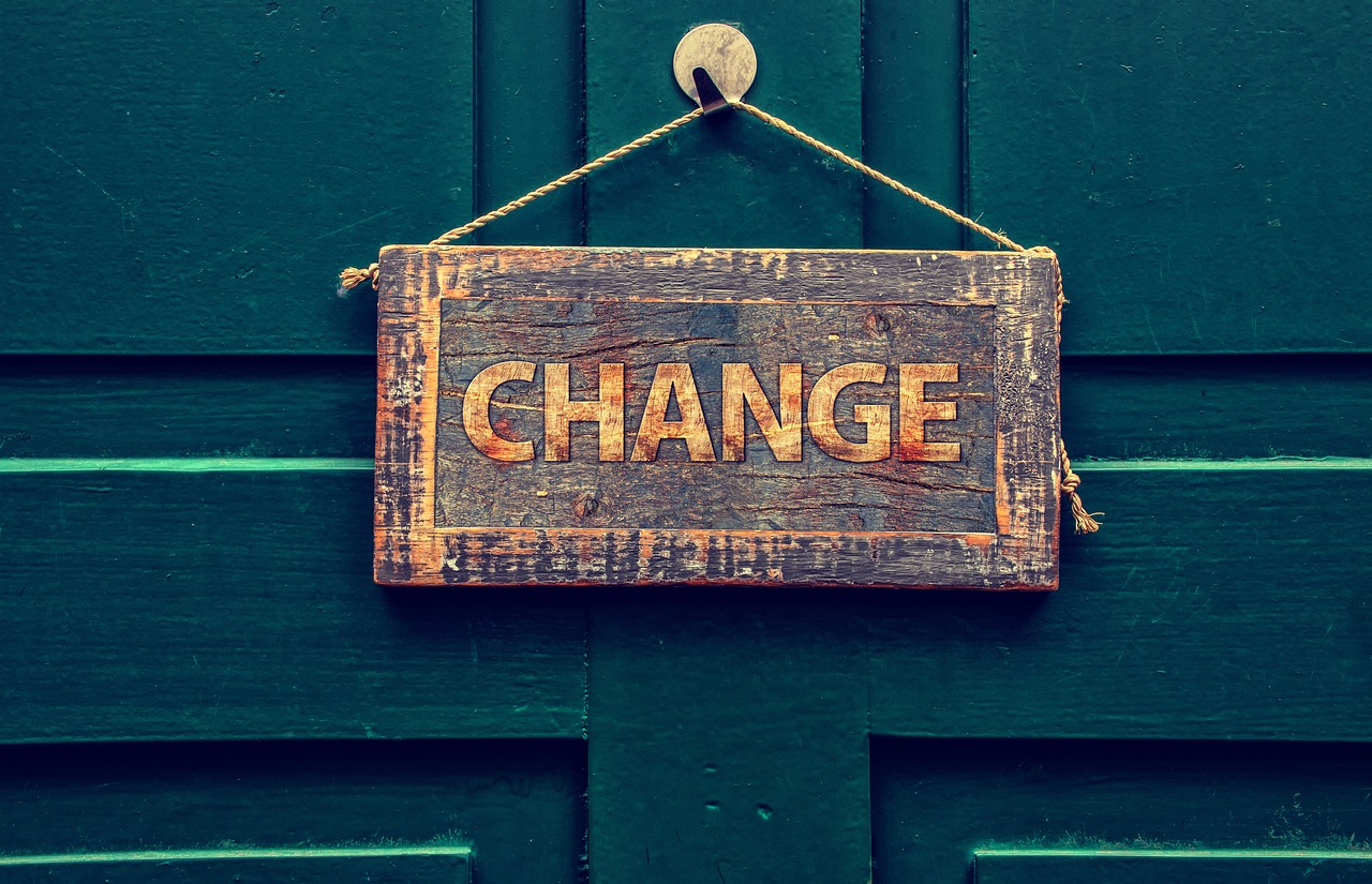 Wooden sign with 'CHANGE' text - Hannah Young Life Coaching