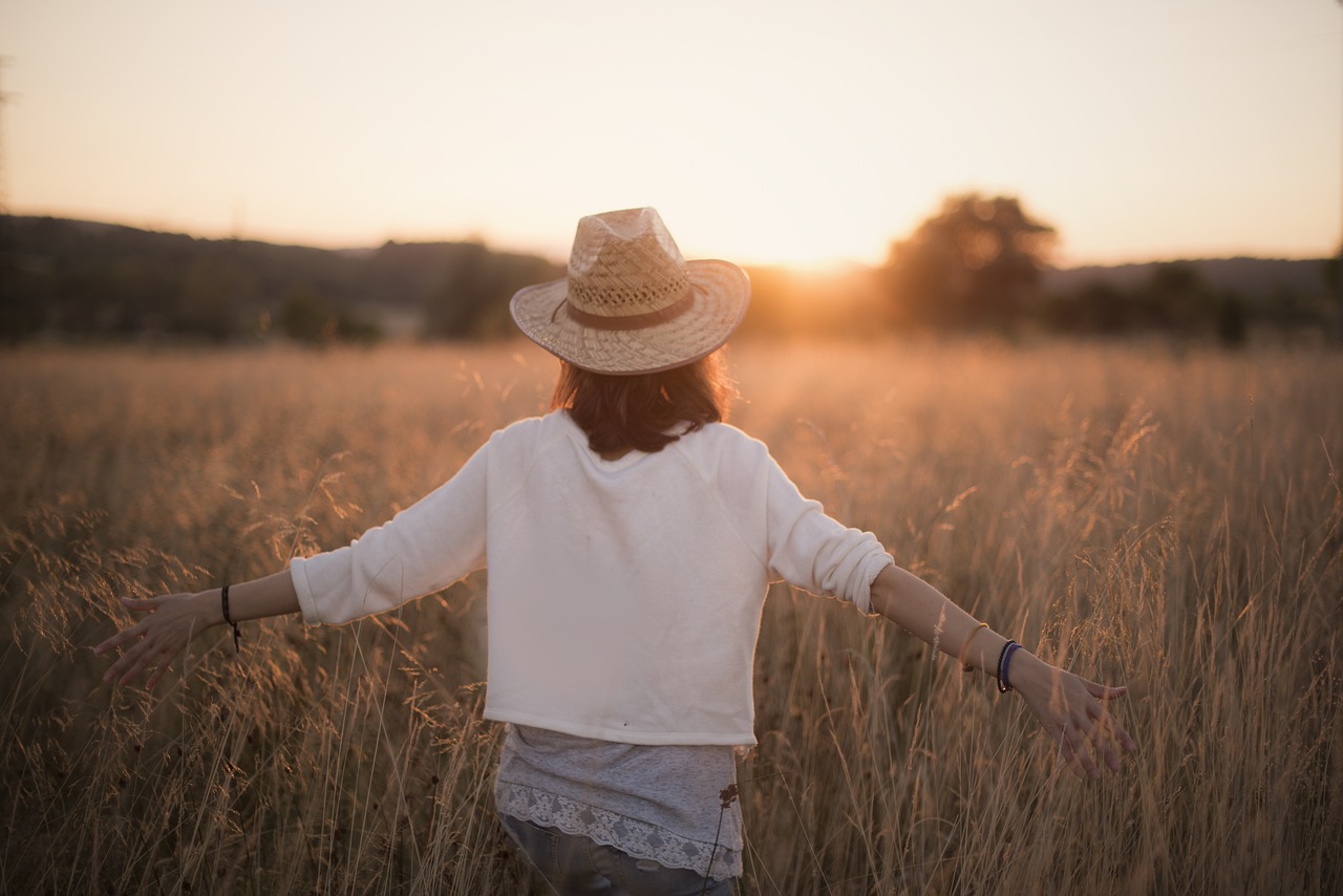 woman enjoying a quiet ordinary moment, reflecting on happiness in everyday life